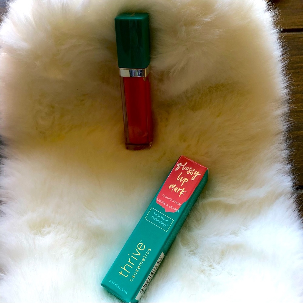 Thrive glossy lip. new original box